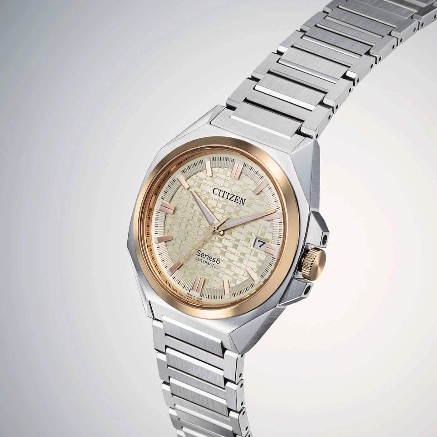Citizen Series 8 automatic watch with gold accents and silver strap.