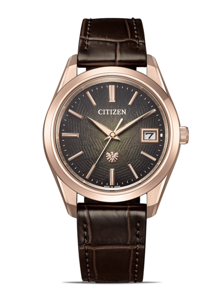 Citizen-Uhr mit braunem Lederarmband und roségoldenem Gehäuse.