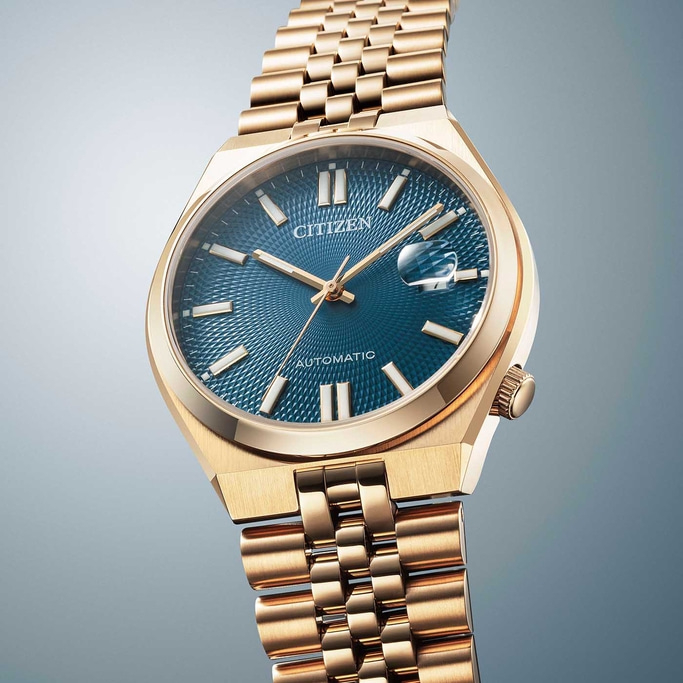 Goldene Citizen-Uhr mit blauem Zifferblatt und goldenem Armband, elegantes Design.